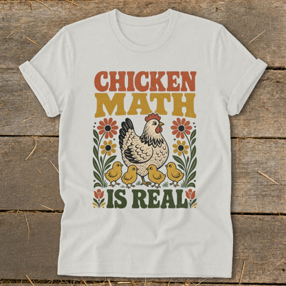 Chicken Math is Real text with hen and chicks illustration on white t-shirt.