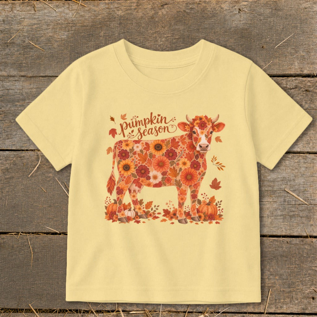 Cow made of autumn flowers with "Pumpkin Season" text.