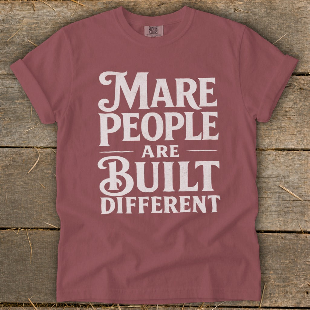Rose t-shirt with white text reading "Mare People Are Built Different".