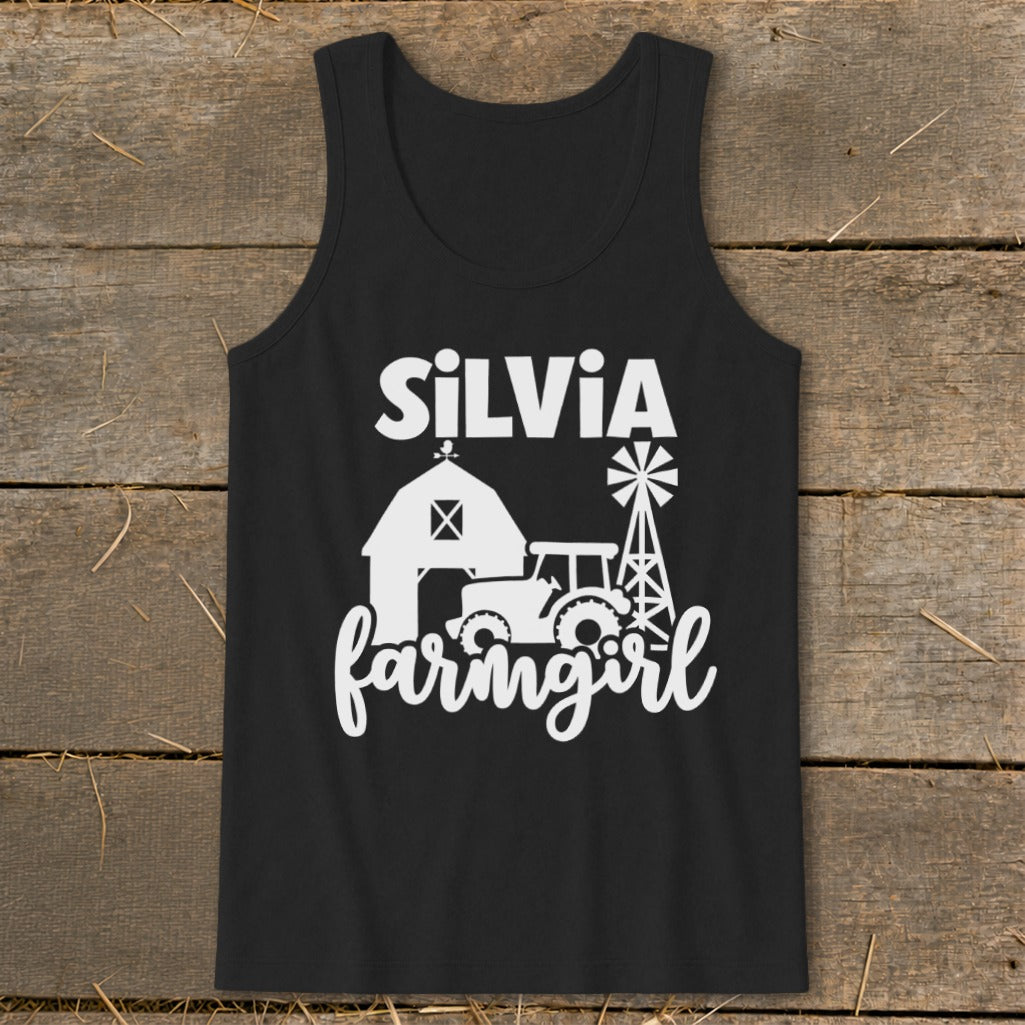 Black tank top with white text "SiLVIA farmgirl" and farm graphics.
