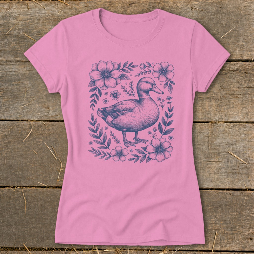 Pink t-shirt with a navy blue duck and floral sketch design.