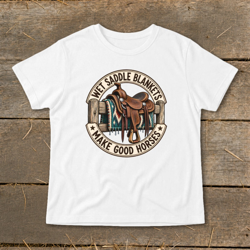 White t-shirt with saddle and blanket graphic, "Wet Saddle Blankets Make Good Horses" text.