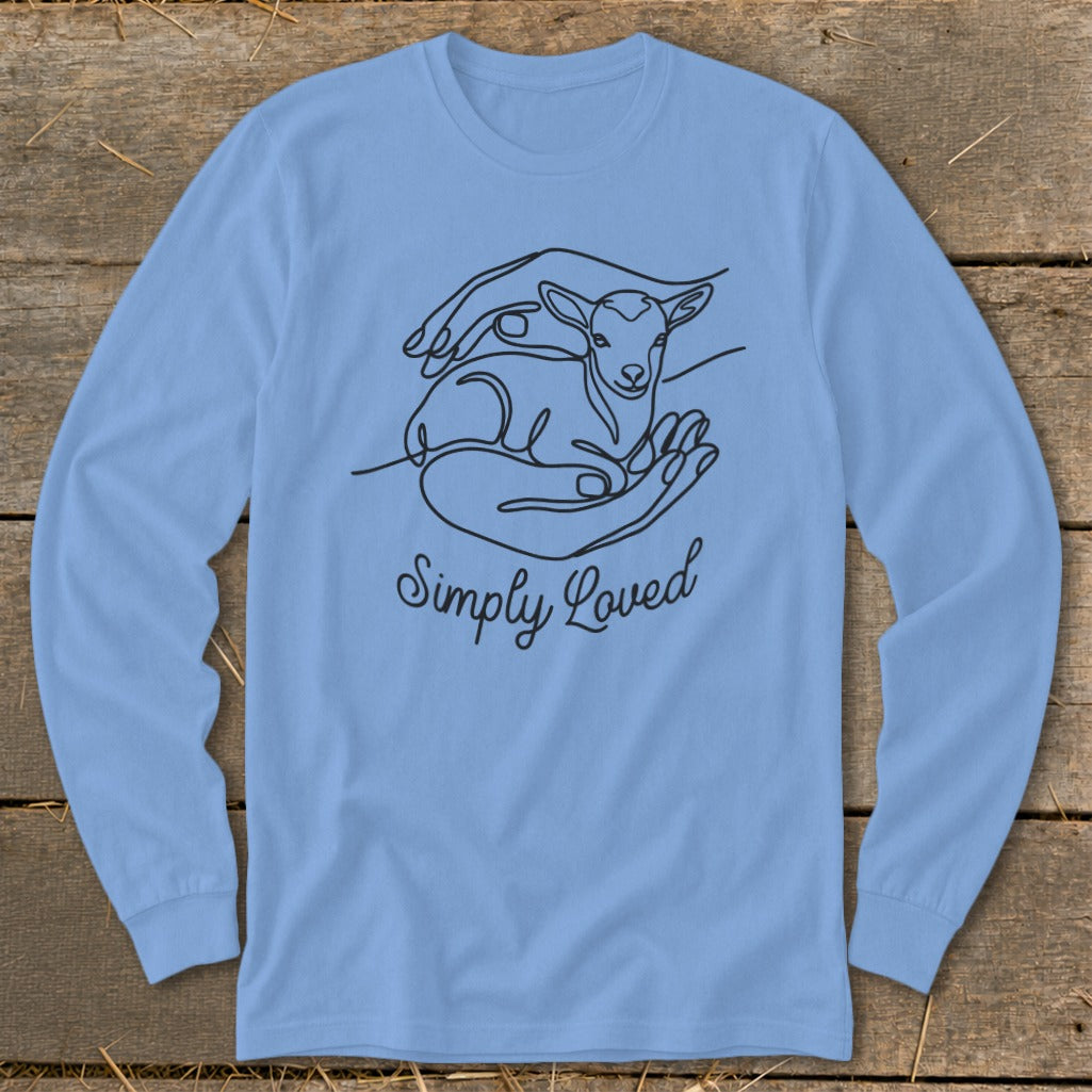 Light blue long-sleeve shirt with line art of hands holding a lamb and text "Simply Loved".