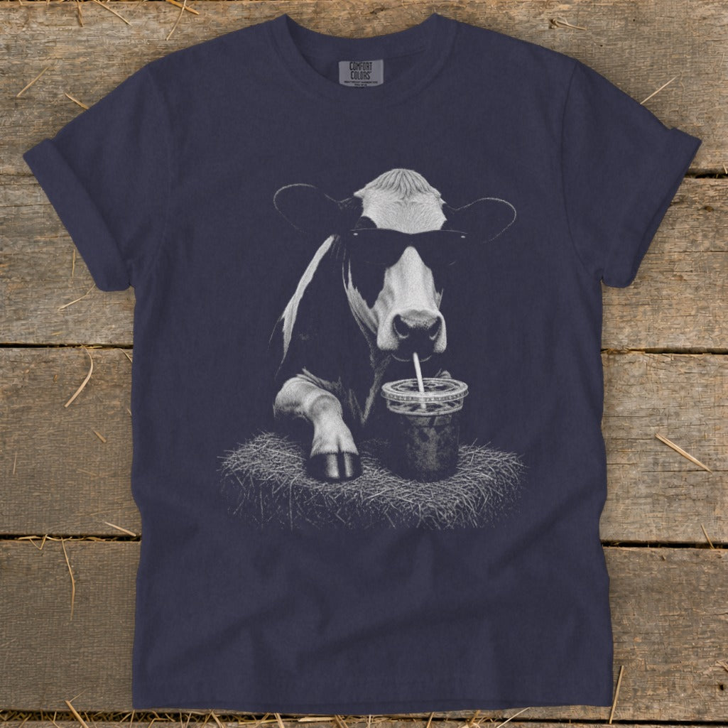 Dark blue t-shirt with a black and white graphic of a cow wearing sunglasses and drinking from a cup.
