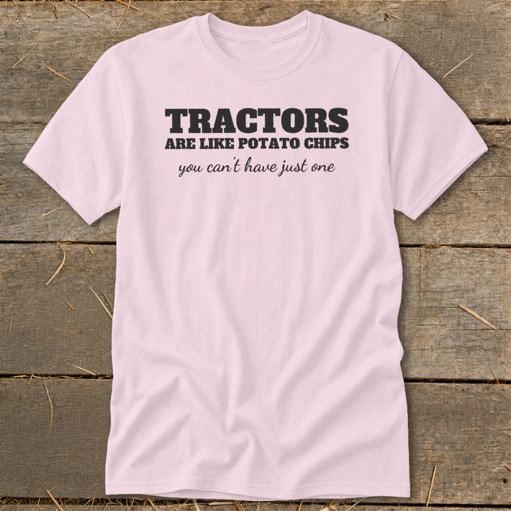 Light pink t-shirt with black text that reads "TRACTORS ARE LIKE POTATO CHIPS you can't have just one".