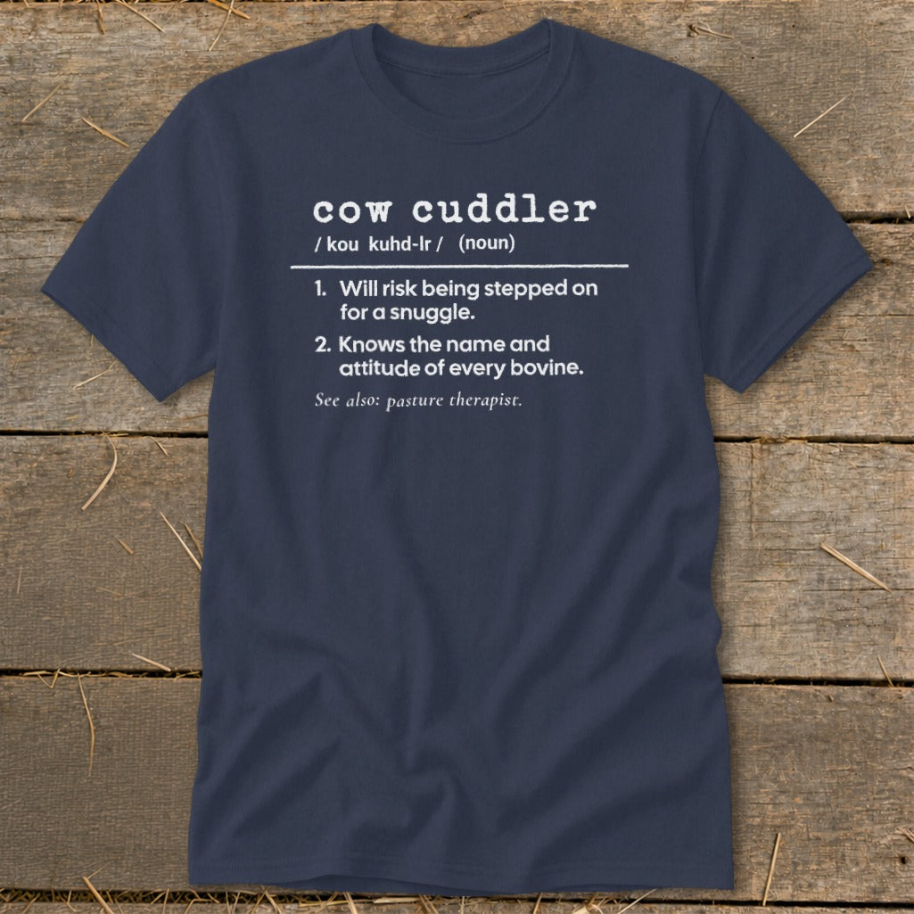 Navy t-shirt with "cow cuddler" definition: risk stepped on for snuggle, knows bovine attitude.