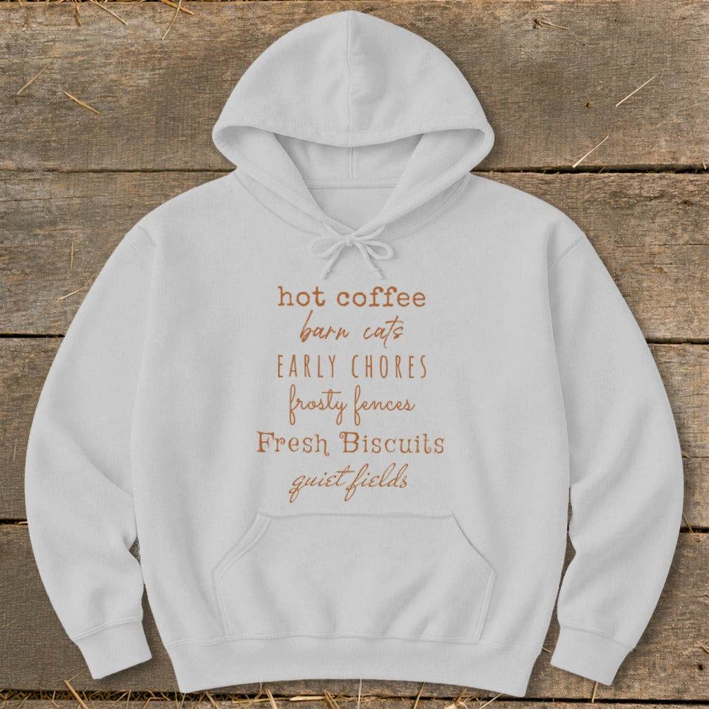 White hoodie with text "hot coffee barn cats EARLY CHORES frosty fences Fresh Biscuits quiet fields".