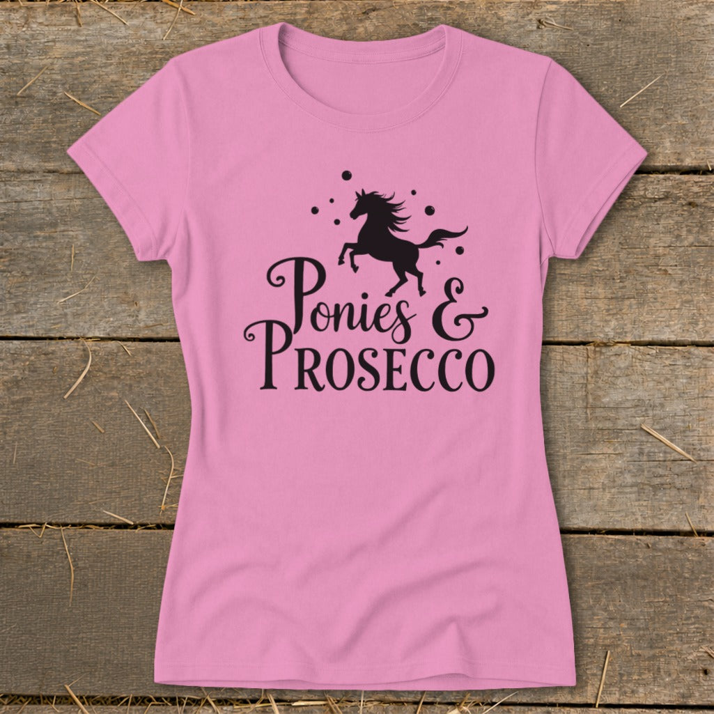 Pink t-shirt with black silhouette of horse and text "Ponies & Prosecco".