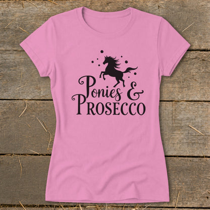 Pink t-shirt with black silhouette of horse and text "Ponies & Prosecco".