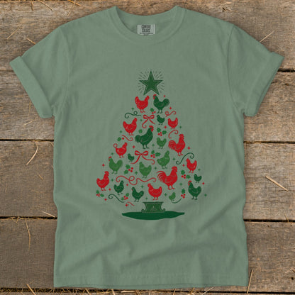 Green t-shirt with a Christmas tree made of red and green chickens and holly.