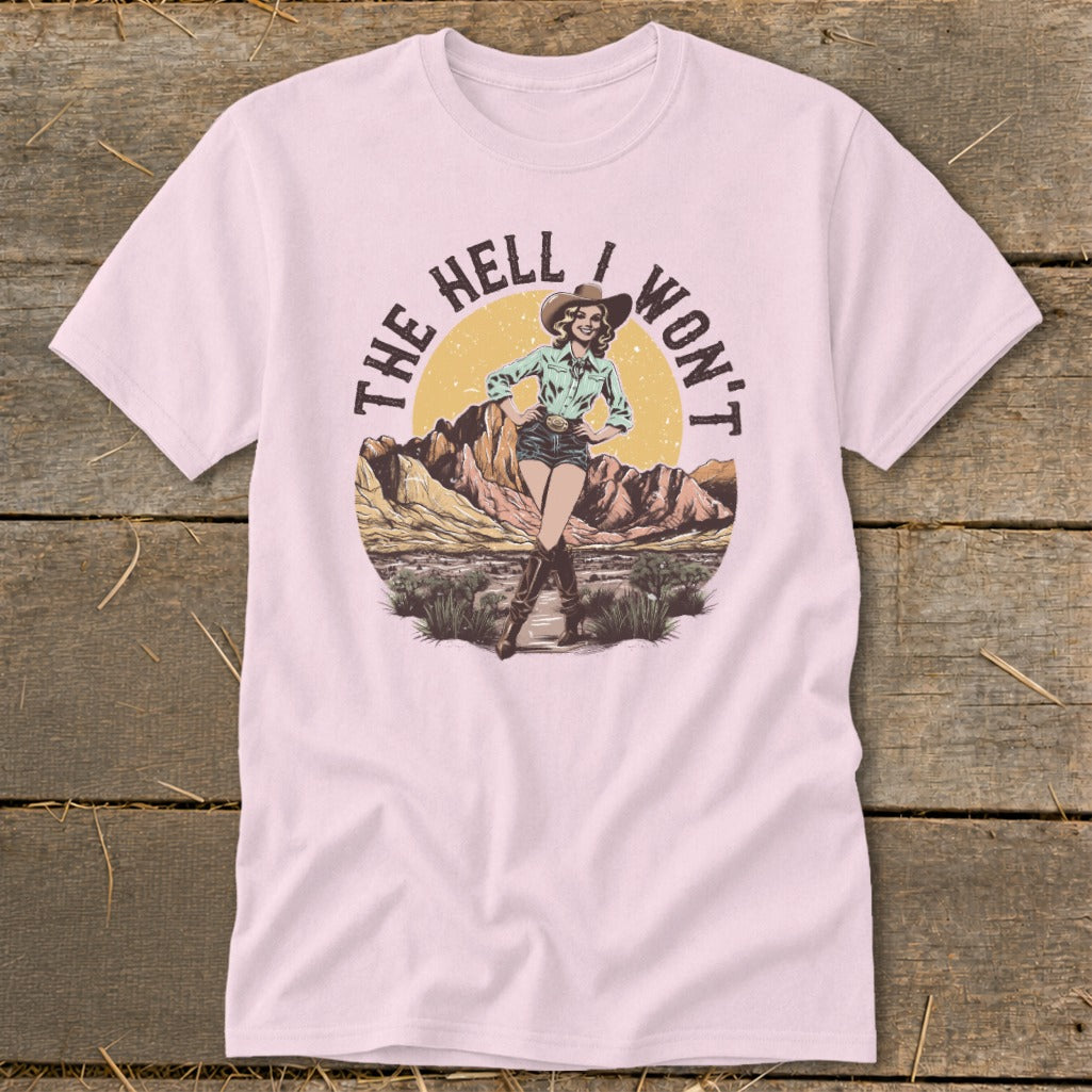 Pink t-shirt with "The Hell I Won't" text and a cowboy illustration.