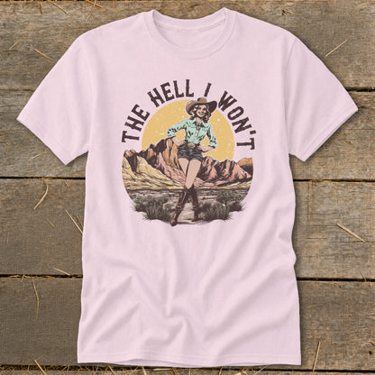 Pink t-shirt with "The Hell I Won't" text and a cowboy illustration.
