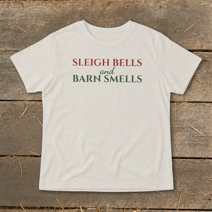 Cream t-shirt with red and green text reading "SLEIGH BELLS and BARN SMELLS."