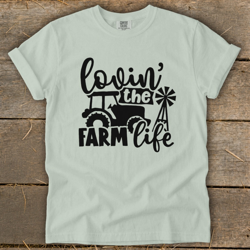 Light green t-shirt with "Lovin' the Farm Life" graphic featuring a tractor and windmill.