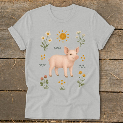 Light gray t-shirt with a cute pig illustration surrounded by flowers, sun, and waves.