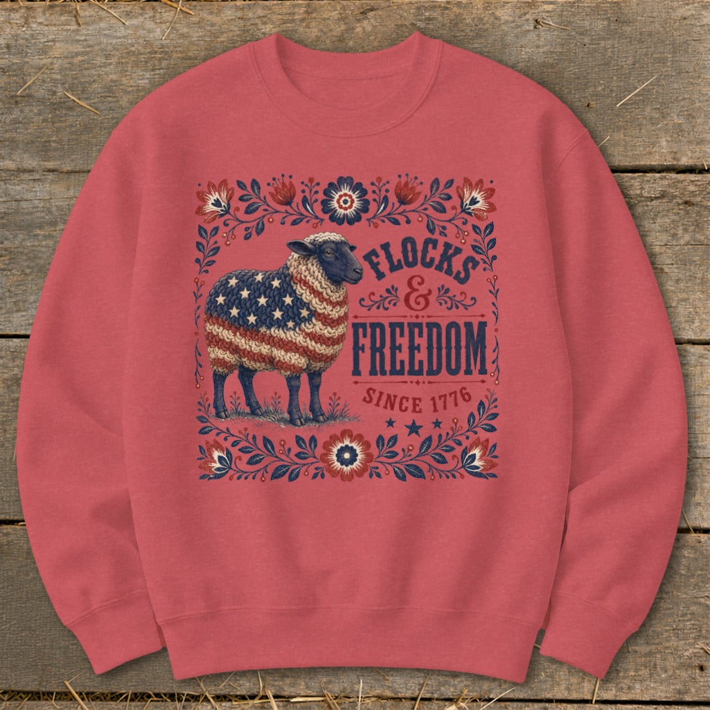 Sheep with American flag fleece, "Flocks & Freedom Since 1776" text.