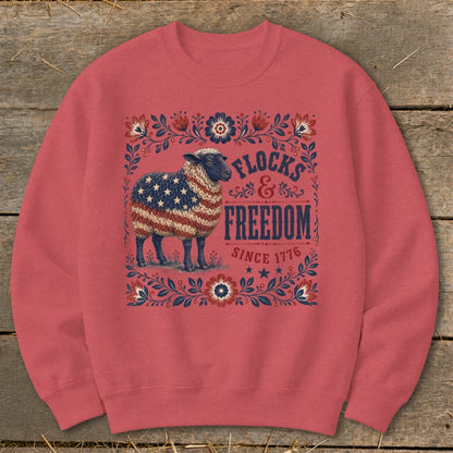 Sheep with American flag fleece, "Flocks & Freedom Since 1776" text.