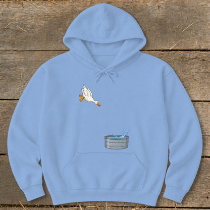 Light blue hoodie with a cartoon duck jumping into a galvanized tub of water.
