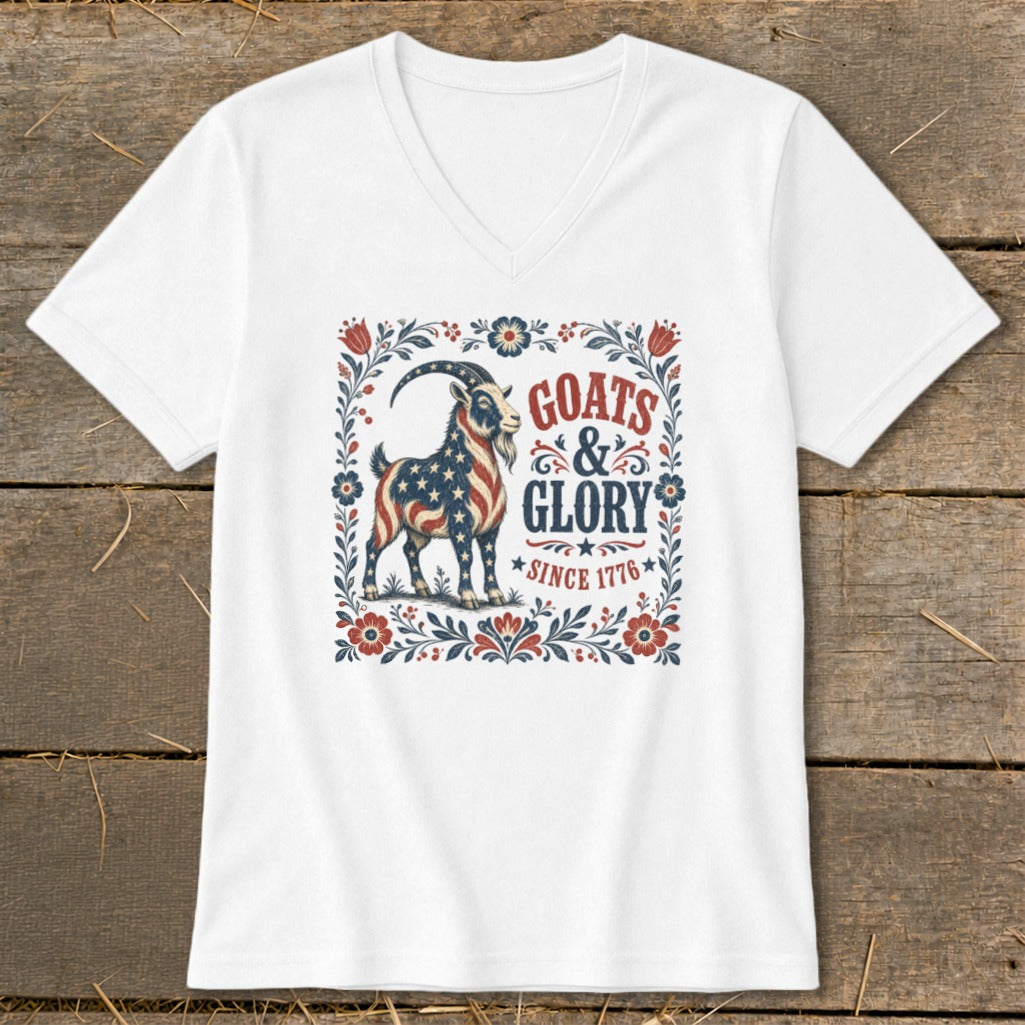 White v-neck t-shirt with "Goats & Glory Since 1776" and a patriotic goat graphic.