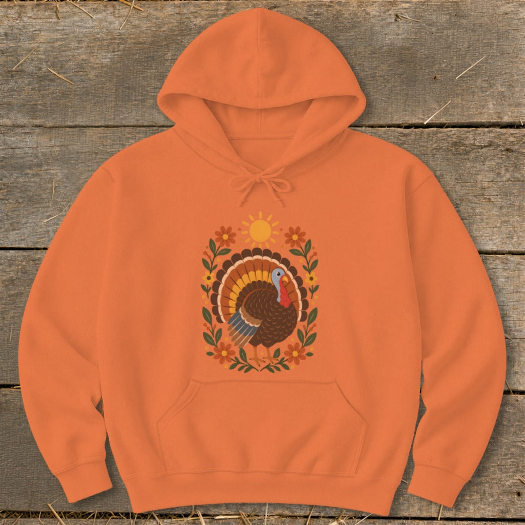 Orange hoodie with a colorful turkey and floral design.