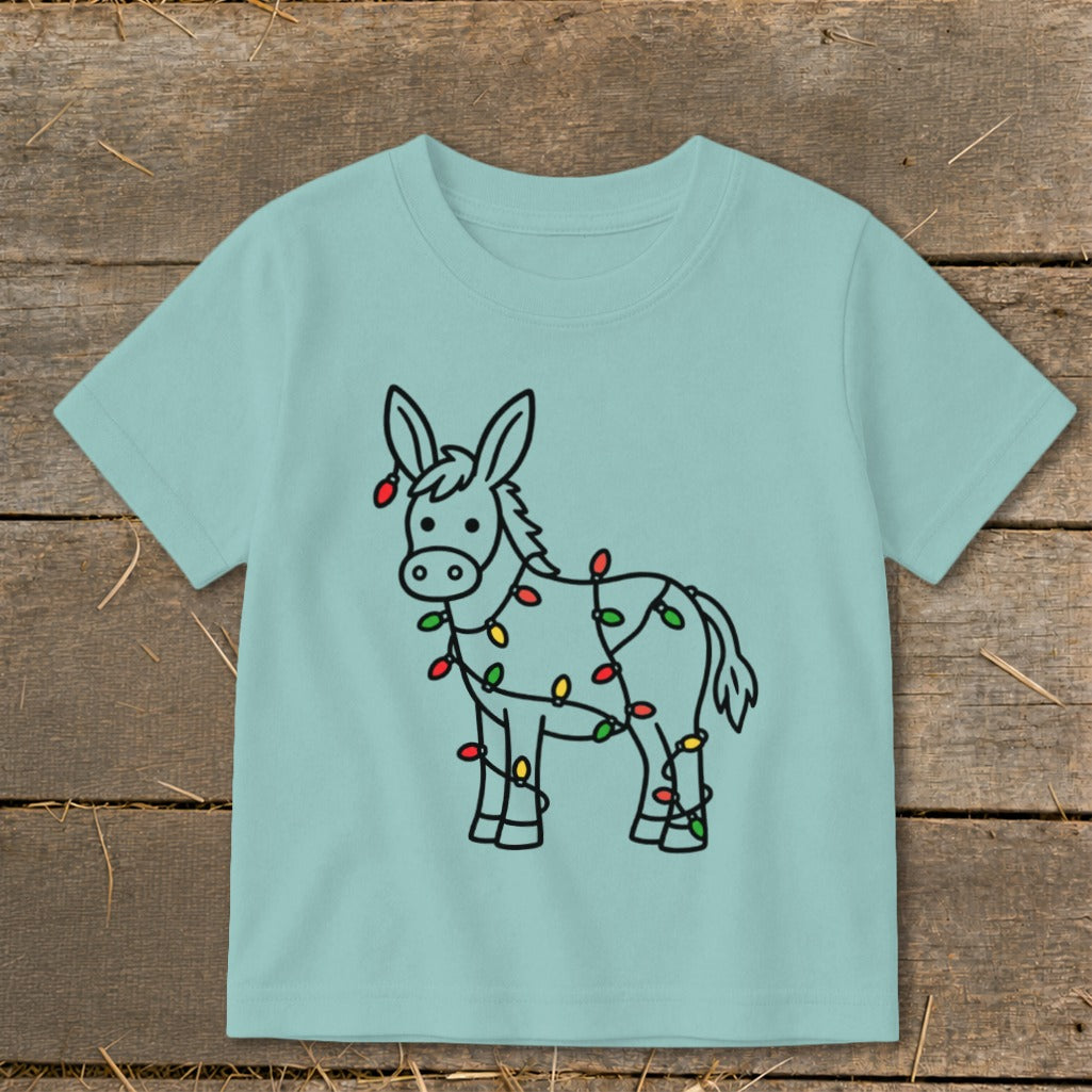 Light blue t-shirt featuring a cartoon donkey wrapped in colorful Christmas lights.