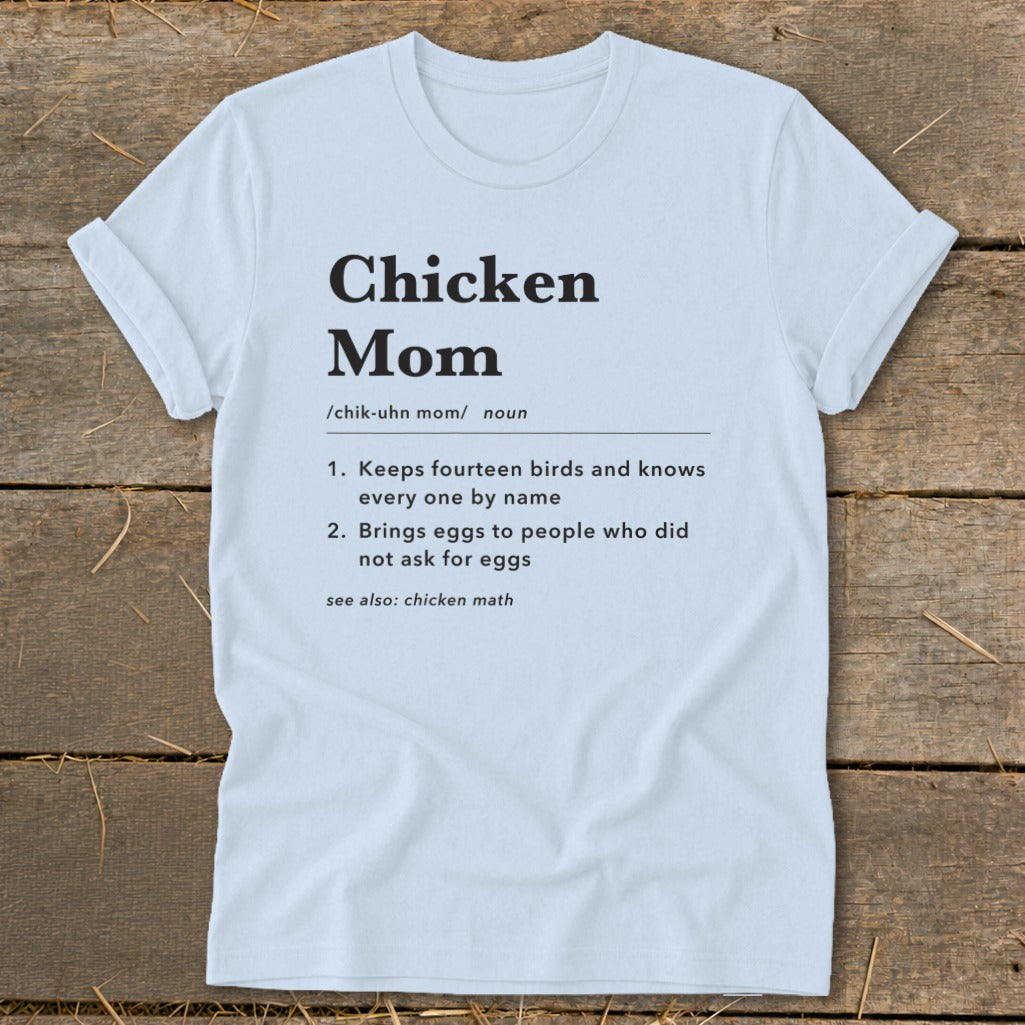 White t-shirt with "Chicken Mom" definition and related phrases in black text.