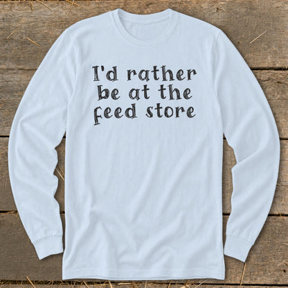 Light blue long-sleeve t-shirt with black text "I'd rather be at the feed store."