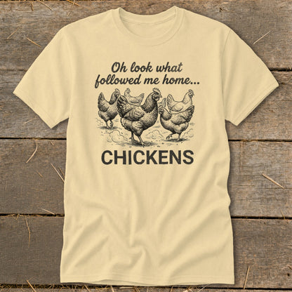 Light yellow t-shirt with black graphic of chickens and text "Oh look what followed me home... CHICKENS".
