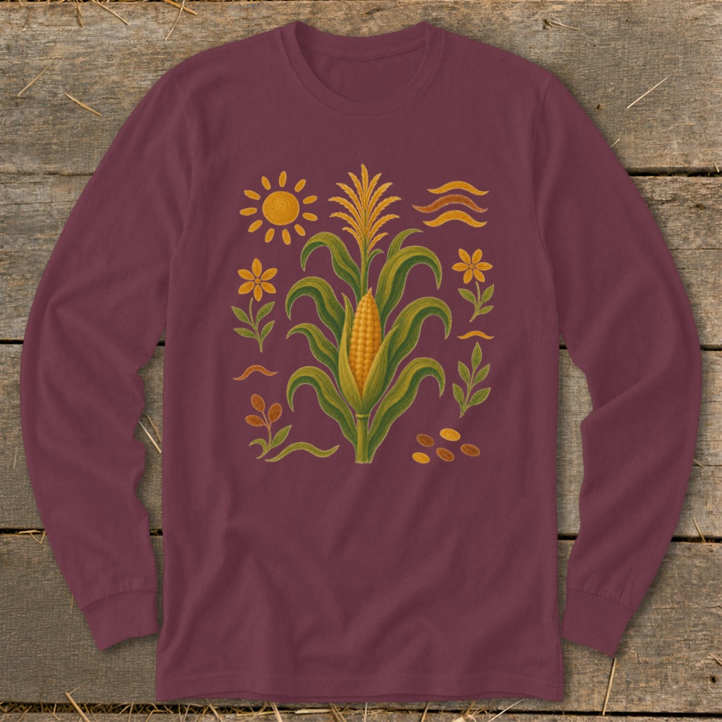 Maroon long-sleeve shirt with corn, sun, and flower folk art design.