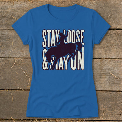 Blue t-shirt with bucking bronco and rider silhouette and text "STAY LOOSE & STAY ON".