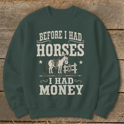 Crewneck sweatshirt with text "Before I Had Horses I Had Money" and cartoon horse graphic.