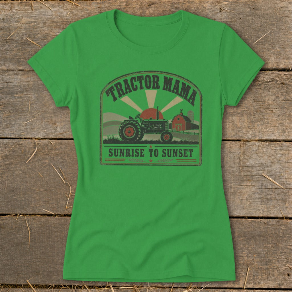 Green t-shirt with a distressed graphic of a tractor, barn, and sun with text "Tractor Mama Sunrise to Sunset."