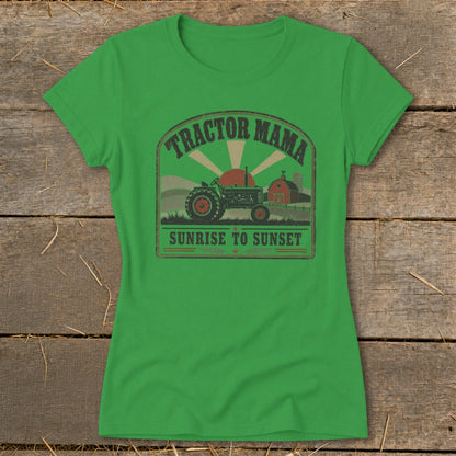 Green t-shirt with a distressed graphic of a tractor, barn, and sun with text "Tractor Mama Sunrise to Sunset."