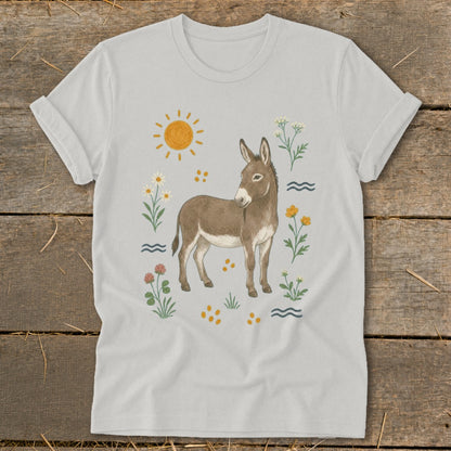 Light gray t-shirt with a brown donkey illustration surrounded by flowers and sun.