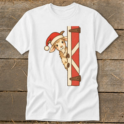 White t-shirt with a cartoon llama wearing a Santa hat peeking from behind a red barn door.
