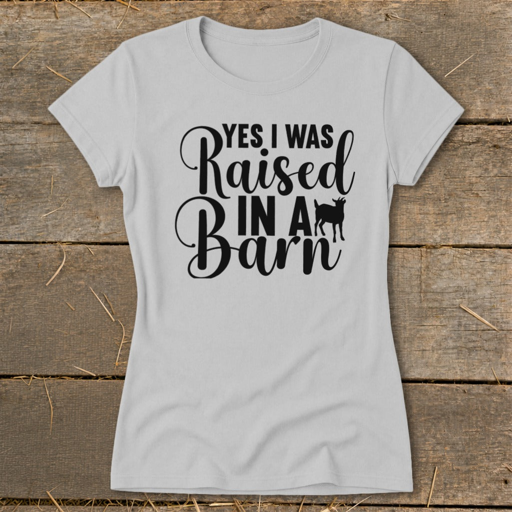Light gray t-shirt with black text "YES I WAS Raised IN A Barn" and a goat silhouette.