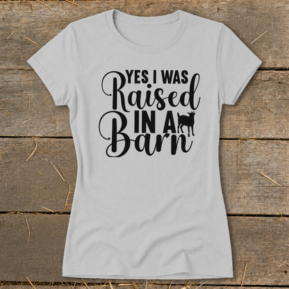 Light gray t-shirt with black text "YES I WAS Raised IN A Barn" and a goat silhouette.