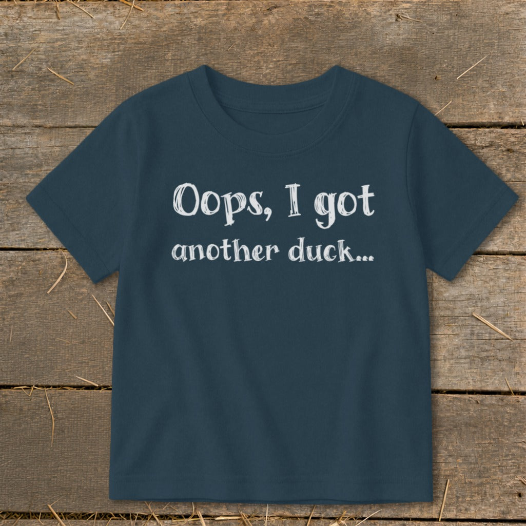 Navy t-shirt with white text that reads "Oops, I got another duck..."