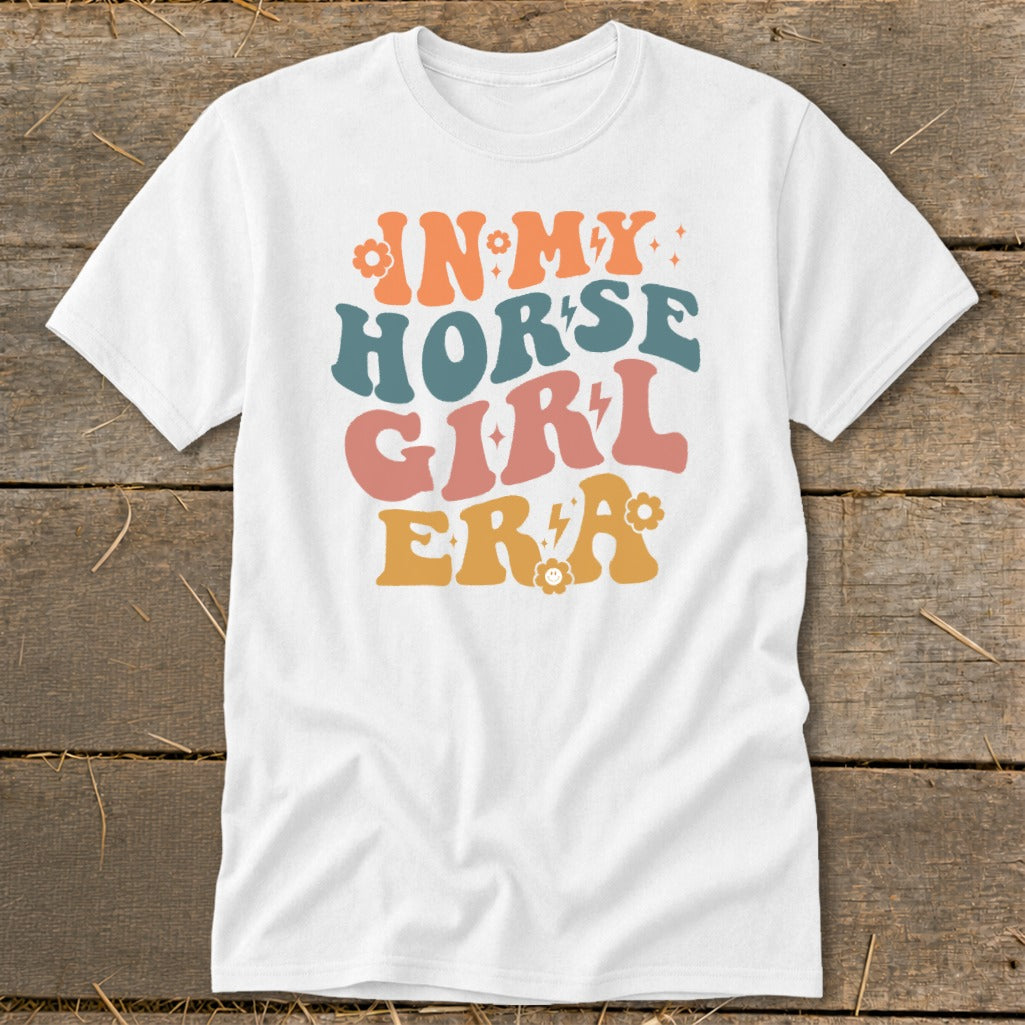 White t-shirt with retro graphic text "IN MY HORSE GIRL ERA".