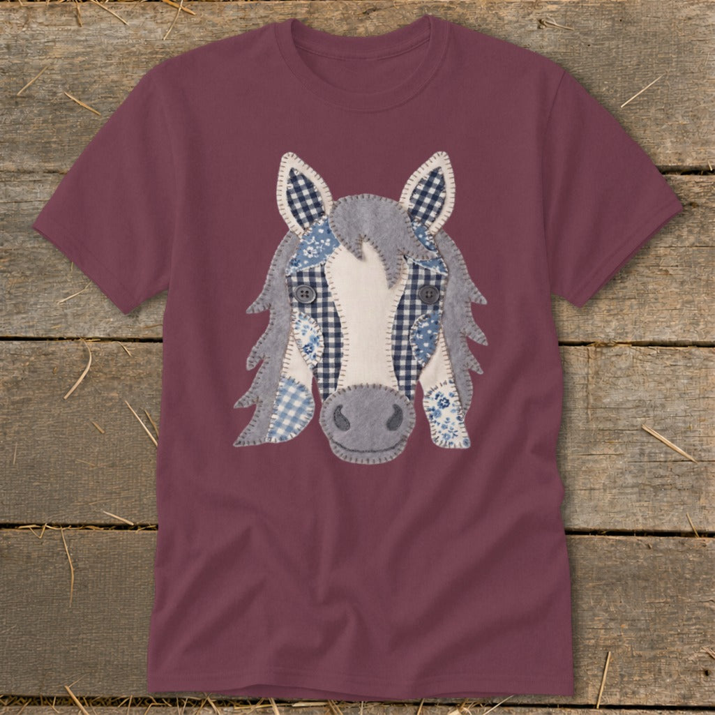 Maroon t-shirt with a patchwork horse face applique in blue gingham and floral patterns.