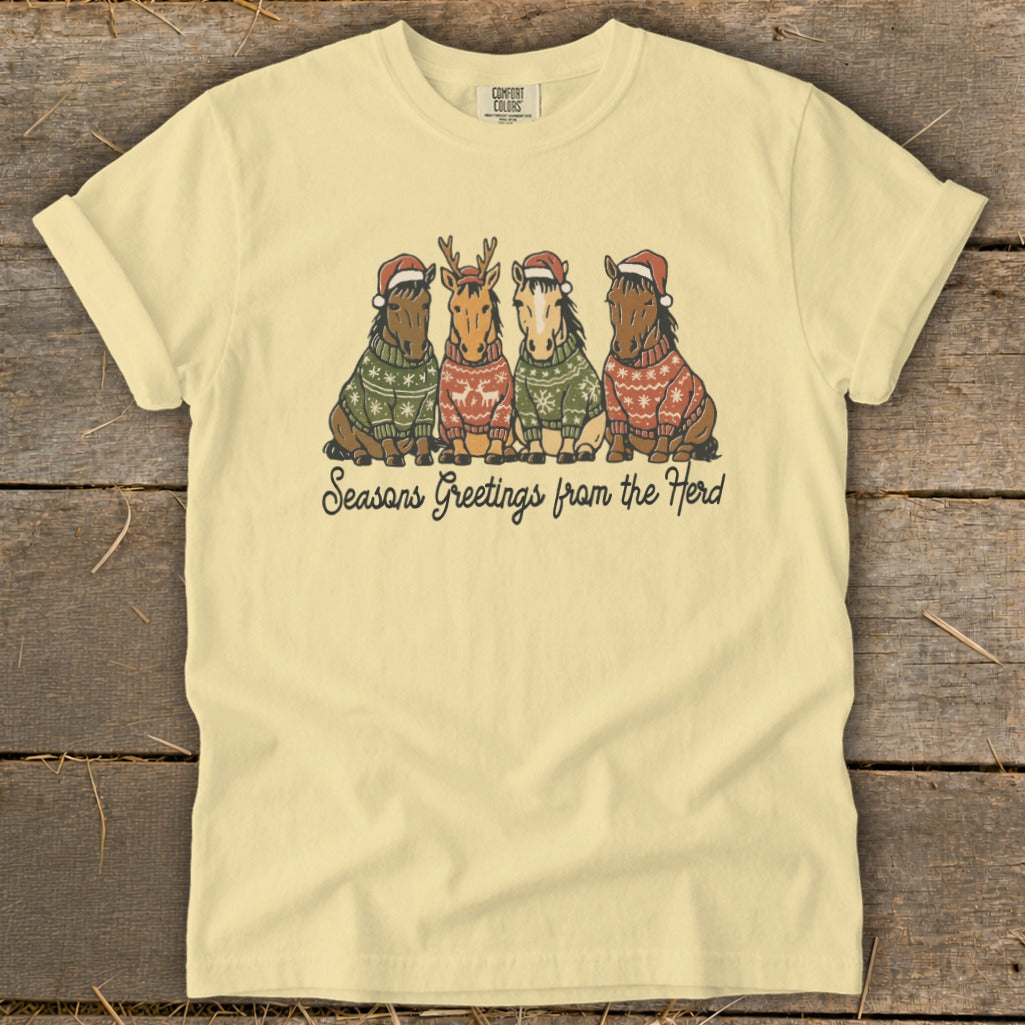 Four horses wearing Santa hats and festive sweaters, with "Seasons Greetings from the Herd" text.