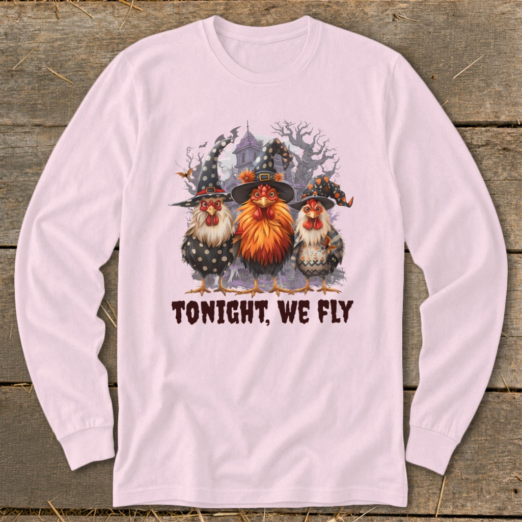 Three chickens in witch hats stand before a haunted house with the text "TONIGHT, WE FLY".