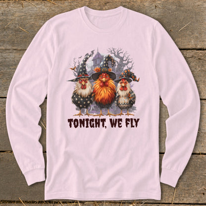 Three chickens in witch hats stand before a haunted house with the text "TONIGHT, WE FLY".