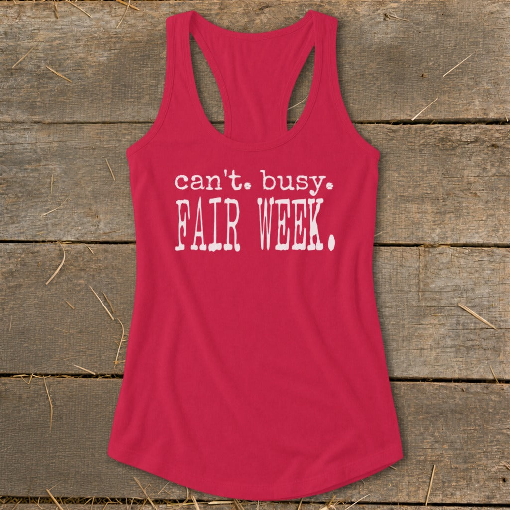 Red racerback tank top with white text that reads "can't. busy. FAIR WEEK."