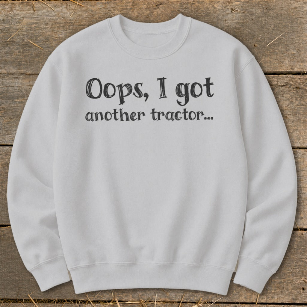 Light grey sweatshirt with black text "Oops, I got another tractor..."