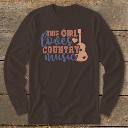 Brown long-sleeve shirt with text "This Girl Loves Country Music" and guitar graphic.