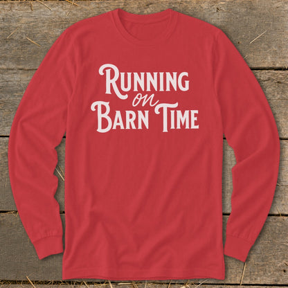 Red long-sleeve shirt with white text "Running on Barn Time."