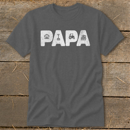 Dark gray t-shirt with "PAPA" text and farm icons: barn, rake, tractor, hay bale.