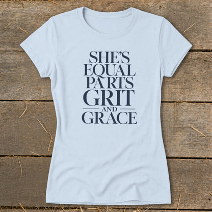 Light blue t-shirt with "She's Equal Parts Grit and Grace" text.