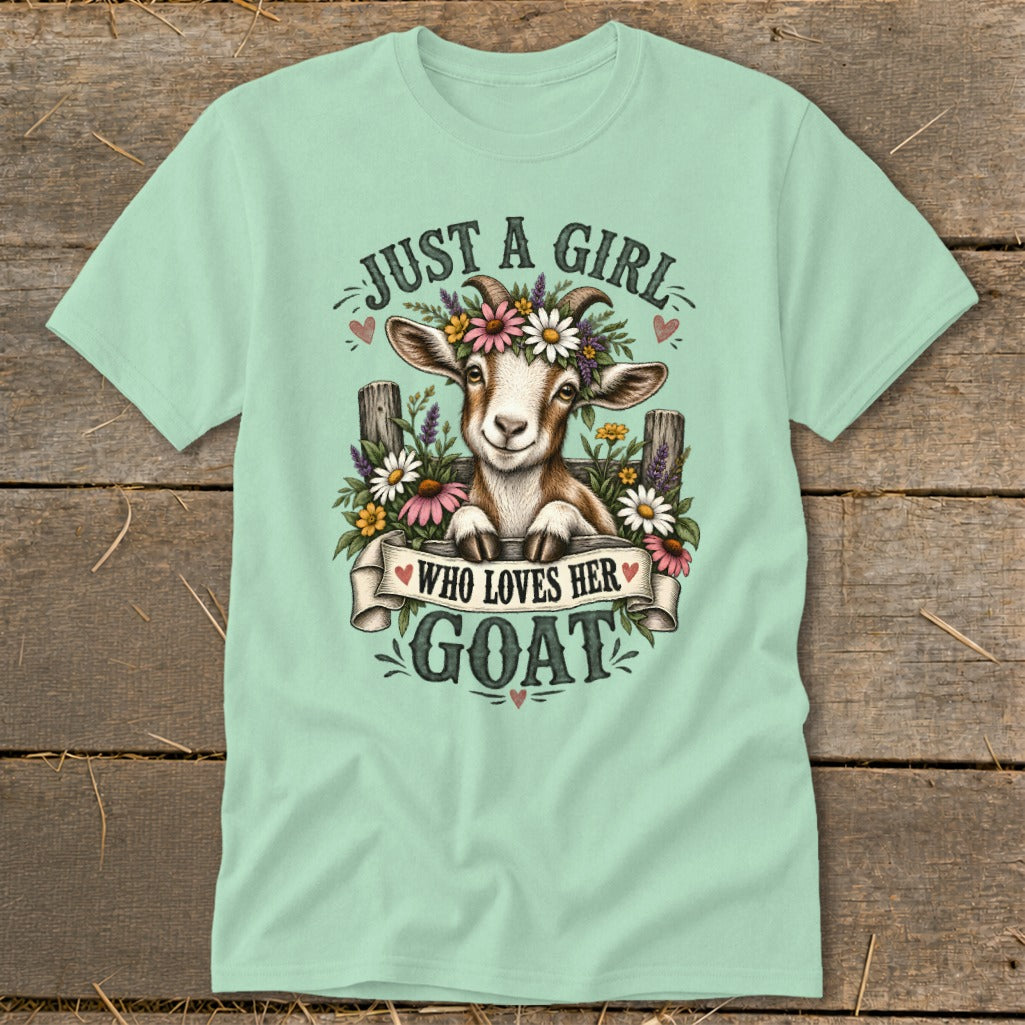 Light green t-shirt featuring a goat with flowers and the text "Just a Girl Who Loves Her Goat".